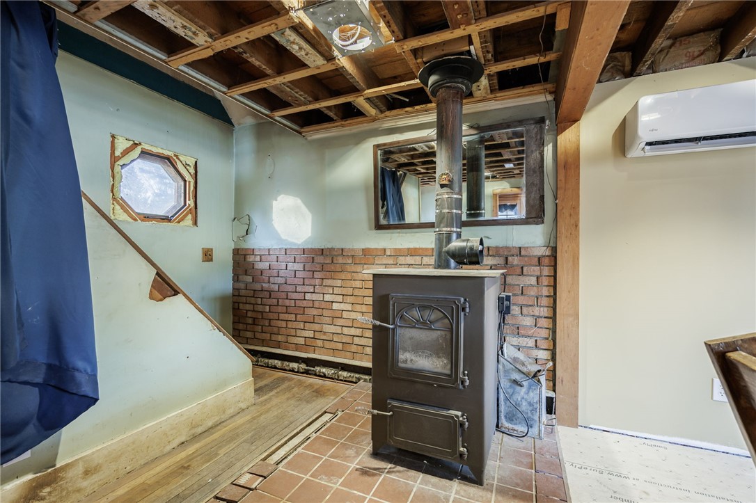 3989 Dean Road Marion, NY 14505 - Photo 11 of 30 Coal Stove in Living Room