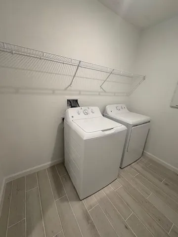a utility room with dryer and washer