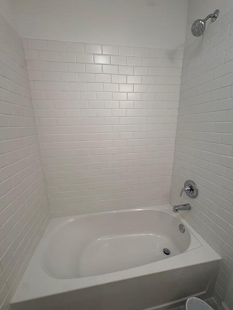 3197 Southwest Savona Boulevard Port St. Lucie, FL 34953 - Photo 19 of 34 a close up of a bathtub in a bathroom