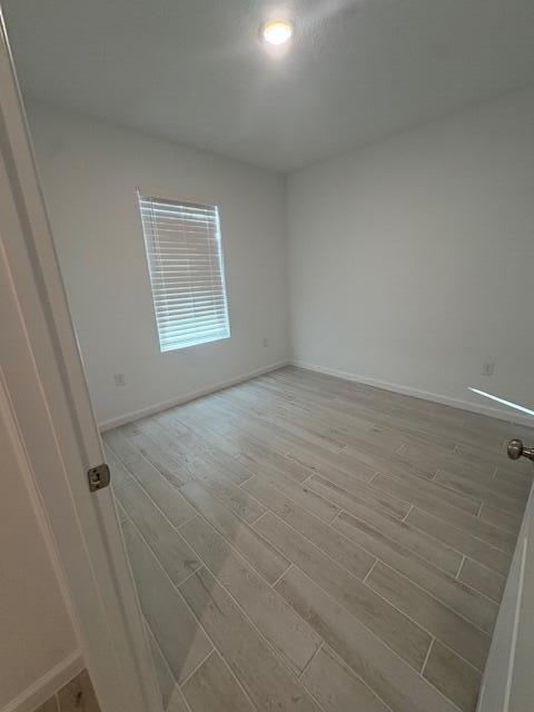 3197 Southwest Savona Boulevard Port St. Lucie, FL 34953 - Photo 27 of 34 wooden floor in an empty room