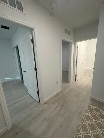 a view of a hallway with staircase