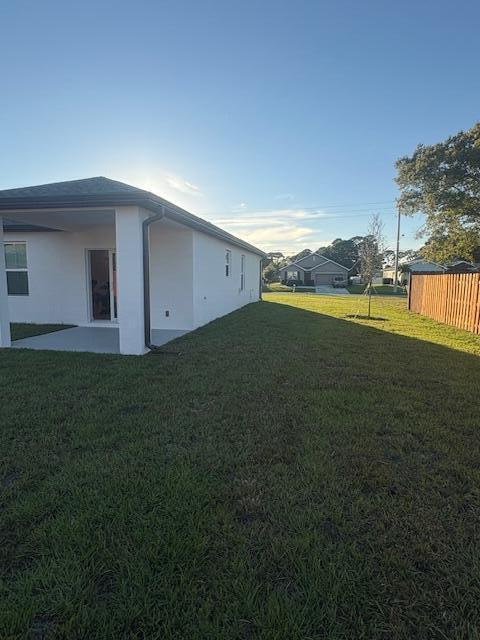 3197 Southwest Savona Boulevard Port St. Lucie, FL 34953 - Photo 34 of 34 a view of a house with a yard