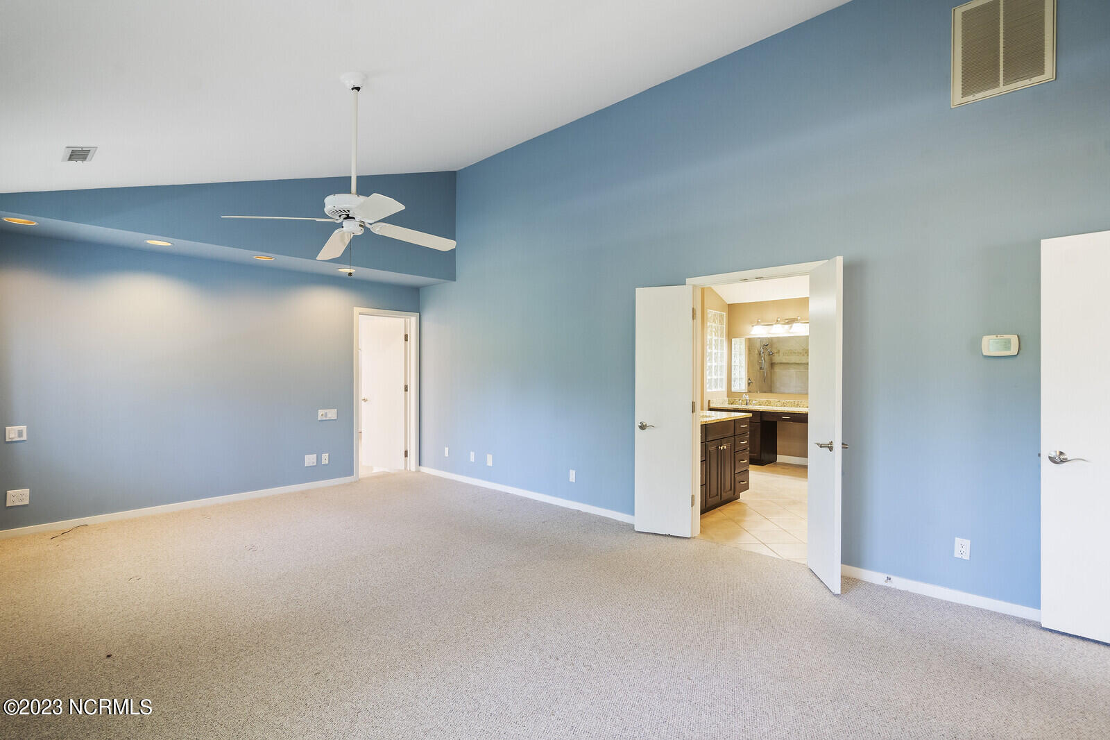 825 South Green Tee Road Hampstead, NC 28443 - Photo 35 of 83 Vaulted ceiling in Primary bedroom