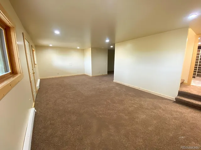a view of a house with a mountain yard in front of it