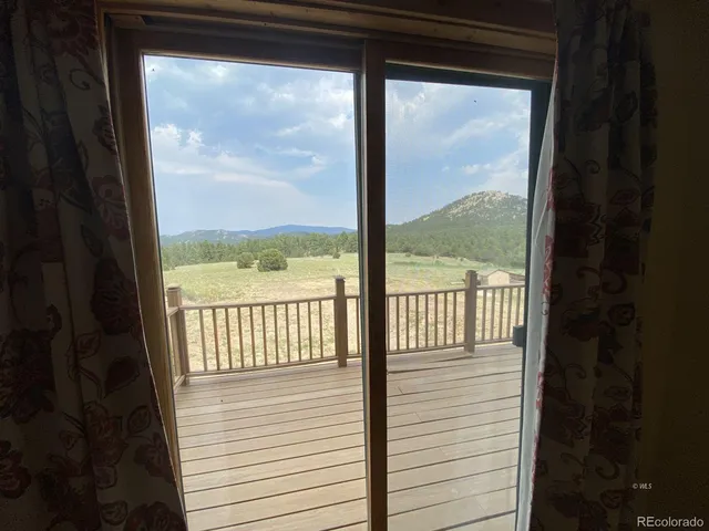 a view of a glass door with a porch