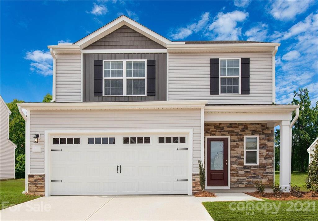 2106 Osten Run Monroe, NC 28110 - Photo 1 of 7 a view of a house with garage
