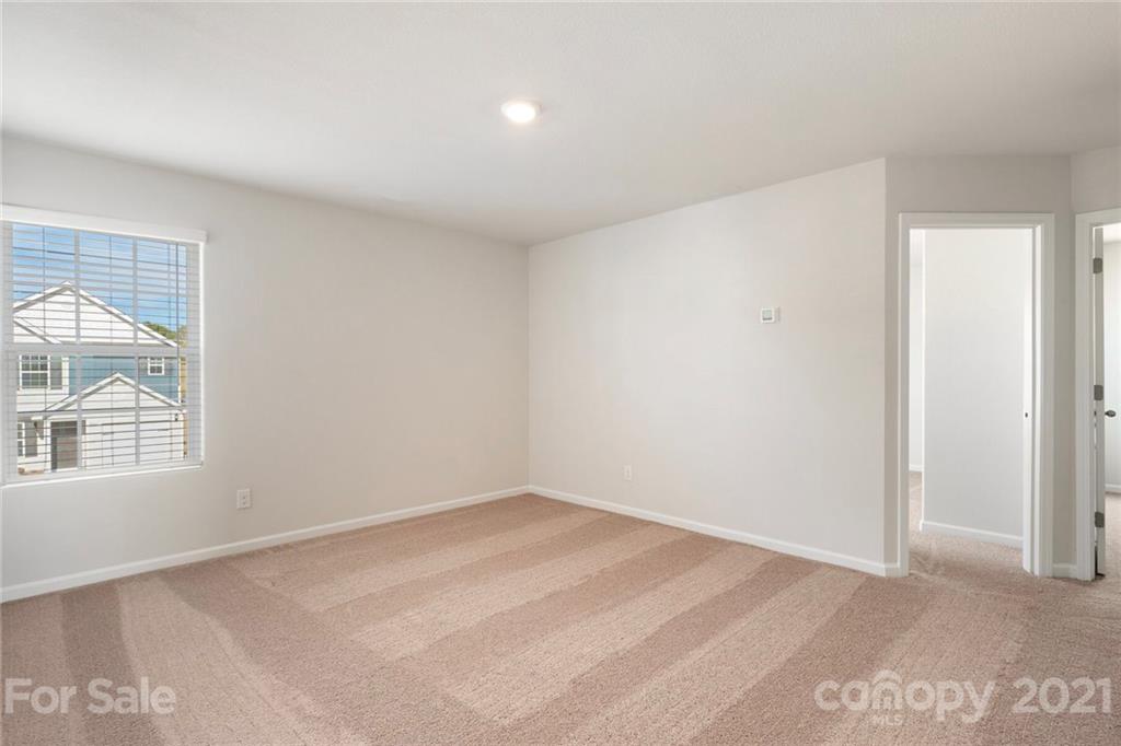 2106 Osten Run Monroe, NC 28110 - Photo 3 of 7 an empty room with a window