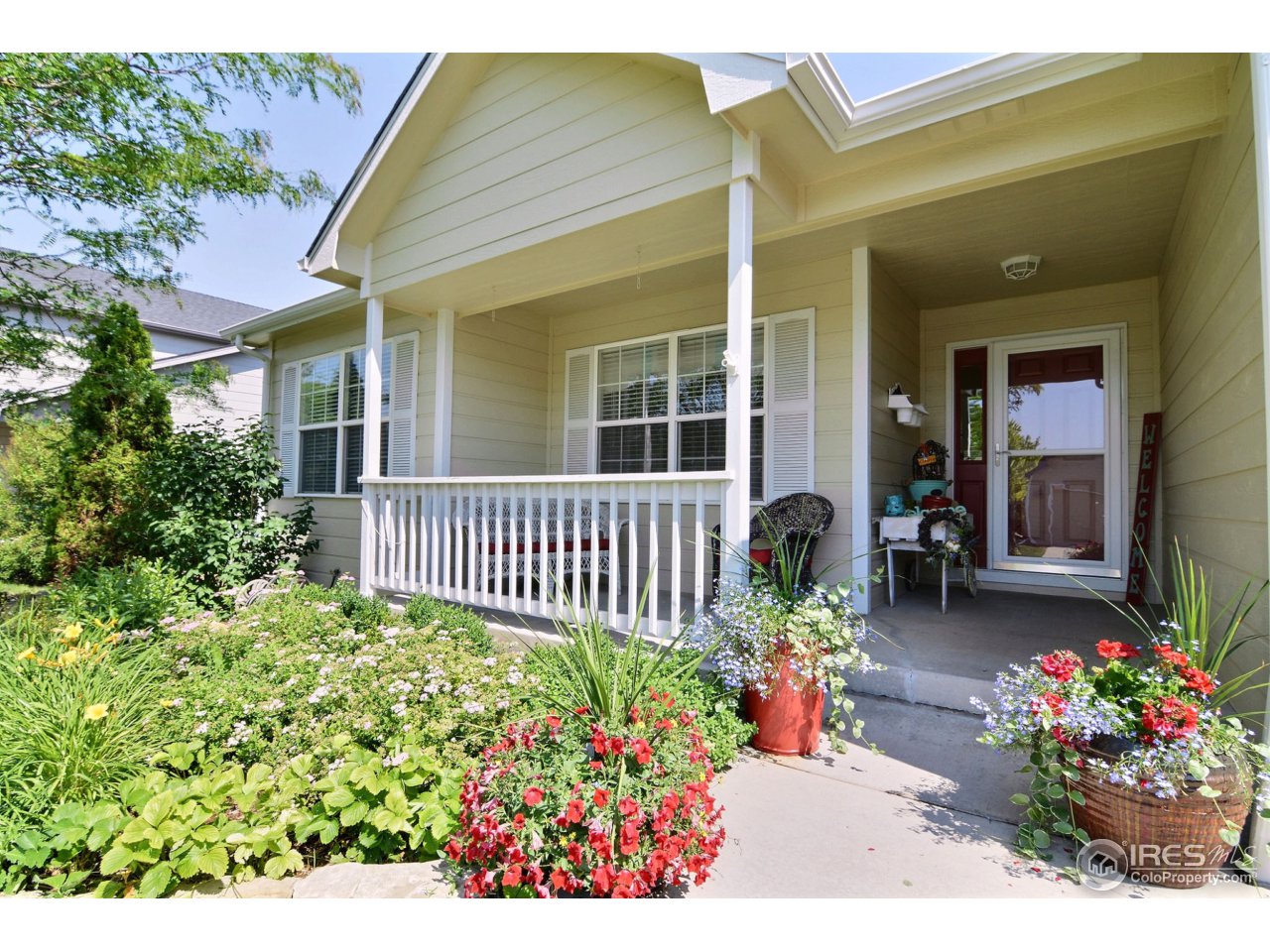 1345 Black Hawk Road Eaton, CO 80615 - Photo 2 of 34 Charming Front Entrance Welcomes Family & Friends
