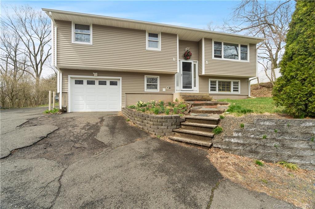 42 Hope Hill Road Wallingford, CT 06492 - Photo 1 of 1 a front view of a house with a yard