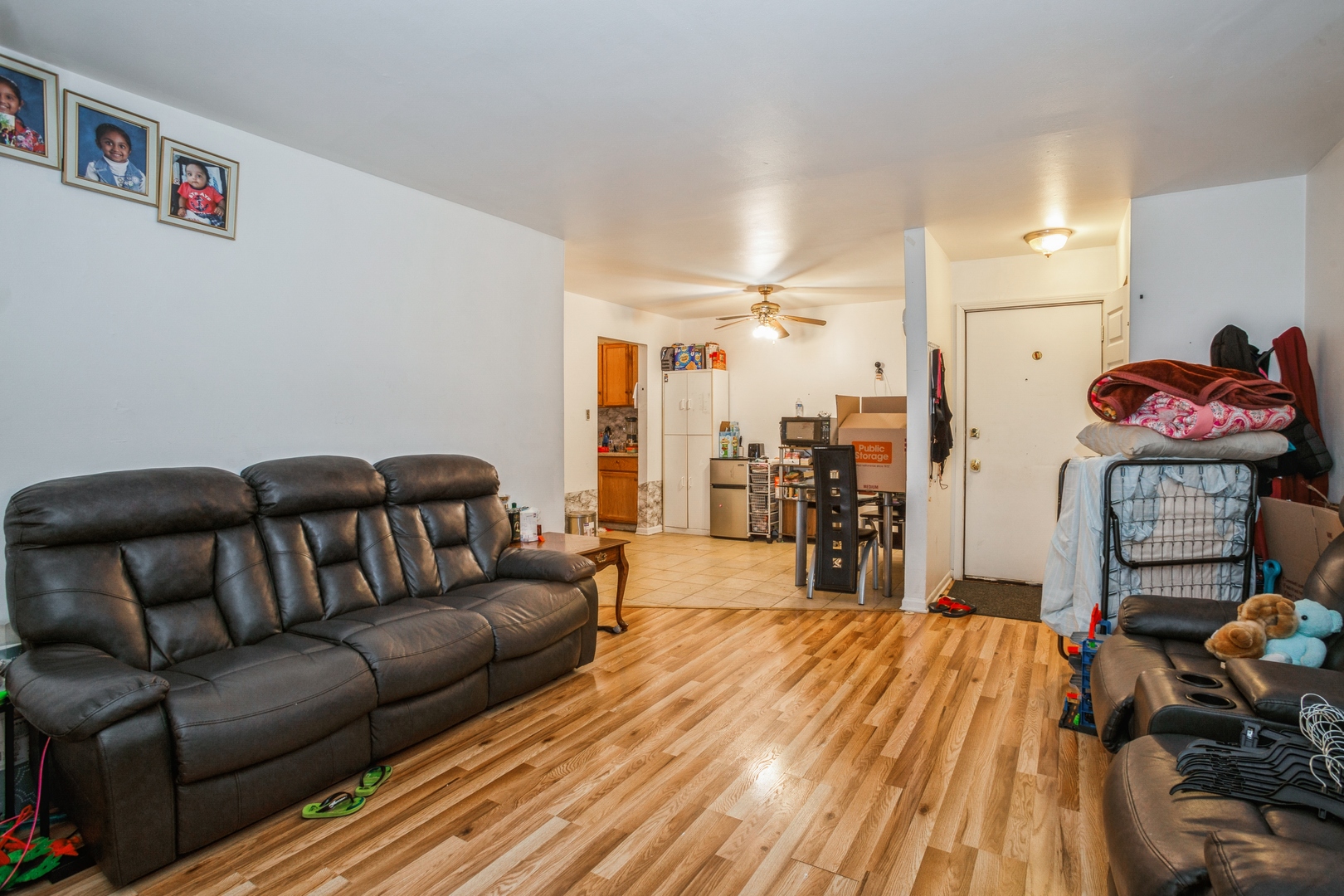 1085 Valley Lane, Unit 8113 Hoffman Estates, IL 60169 - Photo 2 of 10 a living room with furniture and a wooden floor