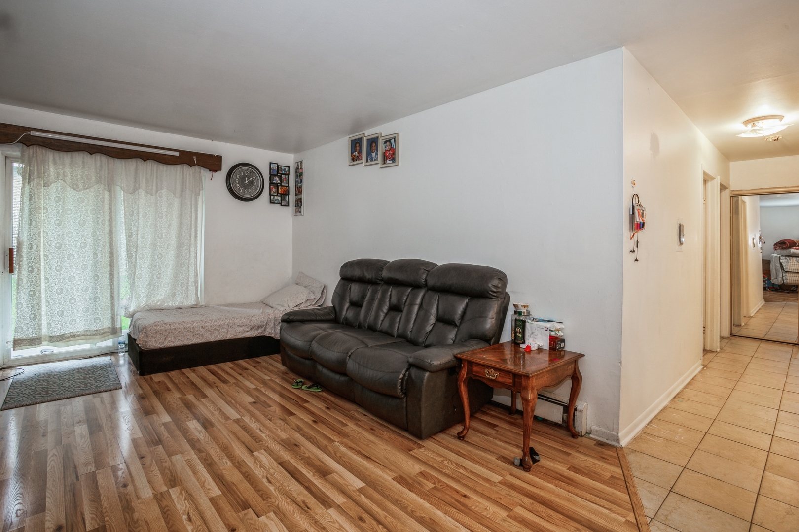 1085 Valley Lane, Unit 8113 Hoffman Estates, IL 60169 - Photo 4 of 10 a living room with furniture and a wooden floor