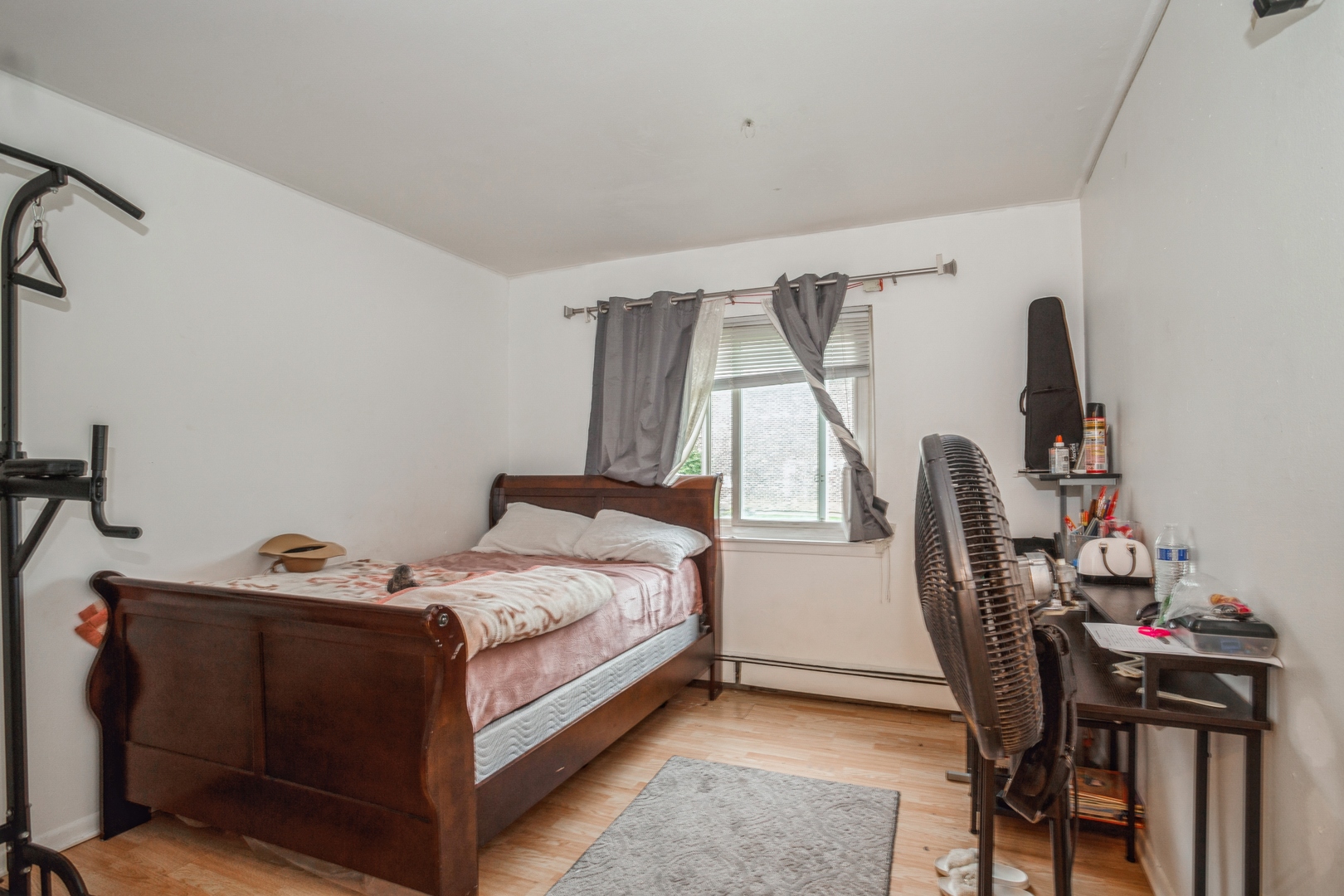 1085 Valley Lane, Unit 8113 Hoffman Estates, IL 60169 - Photo 7 of 10 a bedroom with a bed and a chandelier