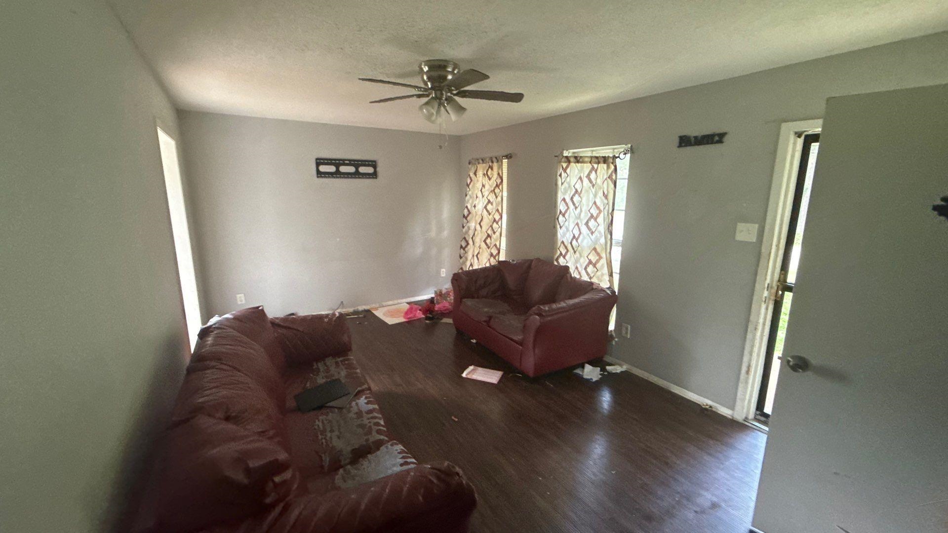 4939 Manson Road Memphis, TN 38109 - Photo 12 of 17 Spacious interior featuring wood-finish flooring, light grey painted walls, and a ceiling fan