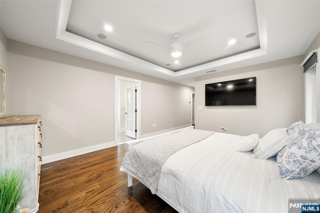 55 Cedar Street Cresskill, NJ 07626 - Photo 20 of 40 a bedroom with a bed and a flat screen tv