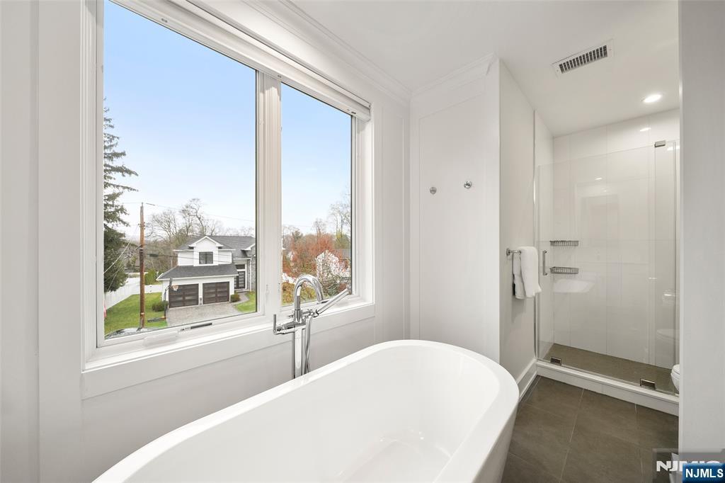 55 Cedar Street Cresskill, NJ 07626 - Photo 22 of 40 a bedroom with a bed and a large window