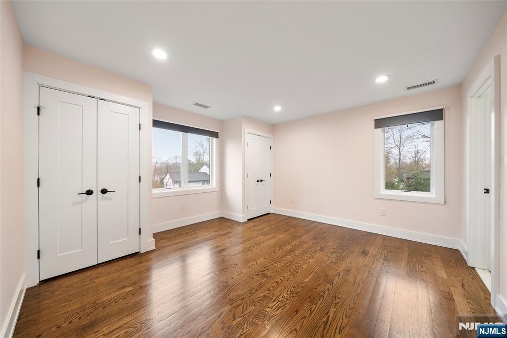 55 Cedar Street Cresskill, NJ 07626 - Photo 30 of 40 a view of an empty room with wooden floor and a window
