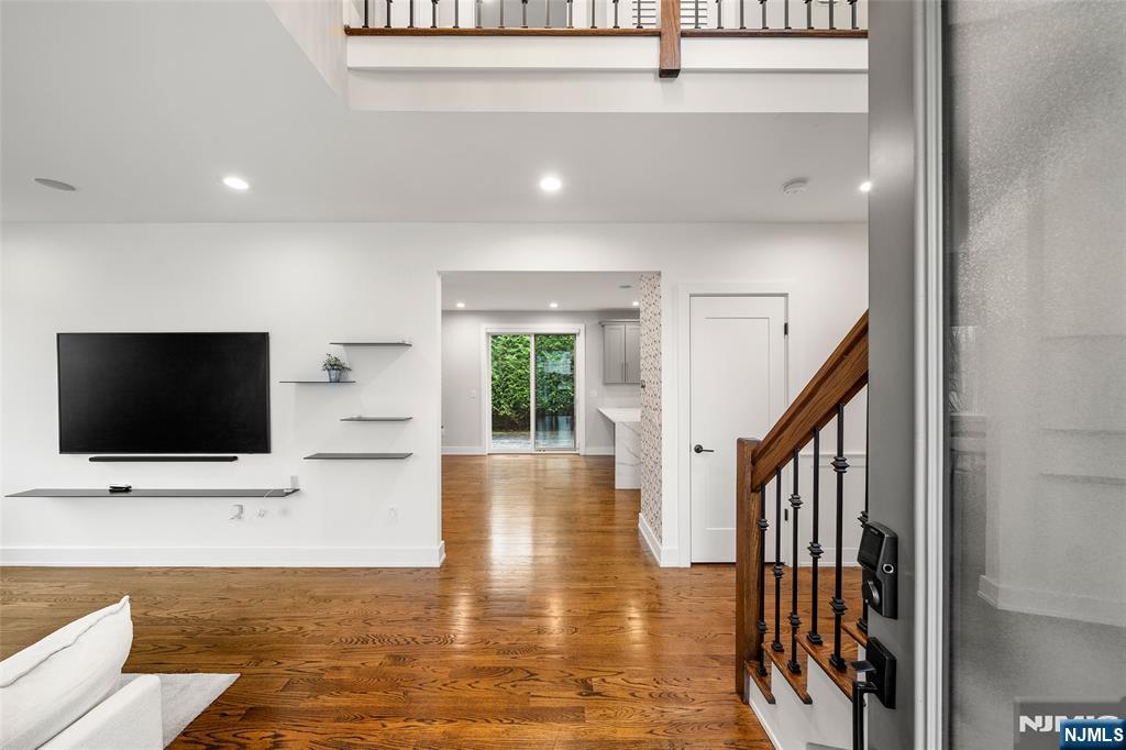 55 Cedar Street Cresskill, NJ 07626 - Photo 5 of 40 a view of a livingroom with wooden floor and a flat screen tv