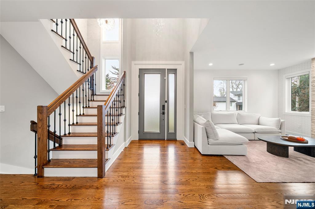 55 Cedar Street Cresskill, NJ 07626 - Photo 6 of 40 a living room with fireplace furniture and a wooden floor