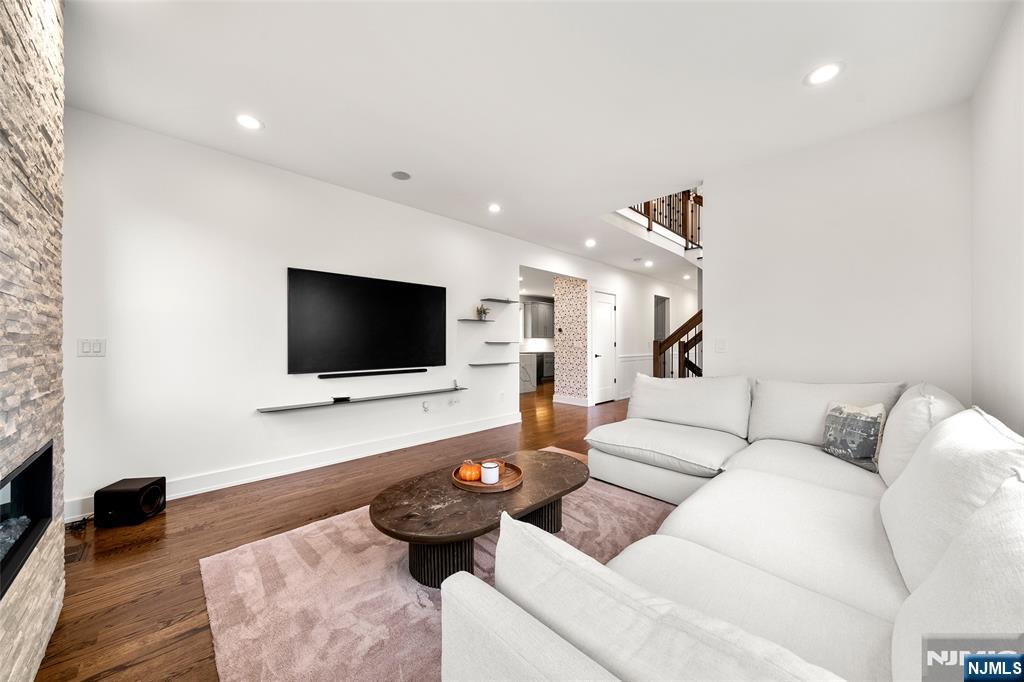55 Cedar Street Cresskill, NJ 07626 - Photo 9 of 40 a living room with furniture and a flat screen tv