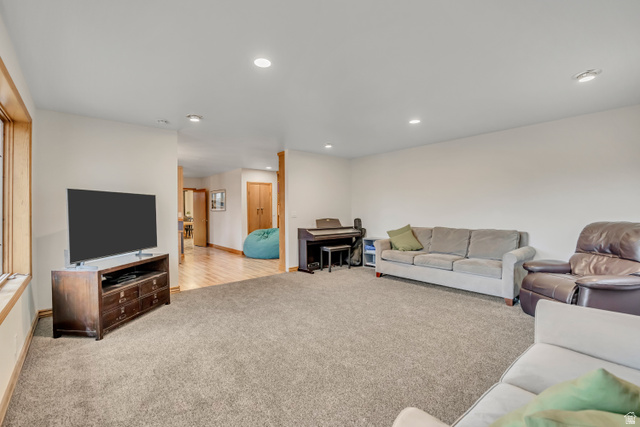 887 Village Way Alpine, UT 84004 - Photo 13 of 28 Living area with light carpet and recessed lighting