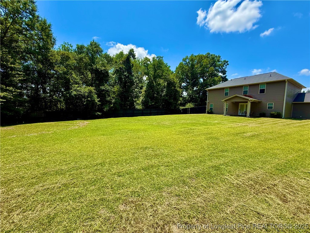 512 Townsend Road Raeford, NC 28376 - Photo 2 of 20 a view of a swimming pool with an outdoor space and seating area
