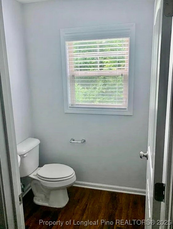 512 Townsend Road Raeford, NC 28376 - Photo 6 of 20 a white toilet sitting in a bathroom next to a window