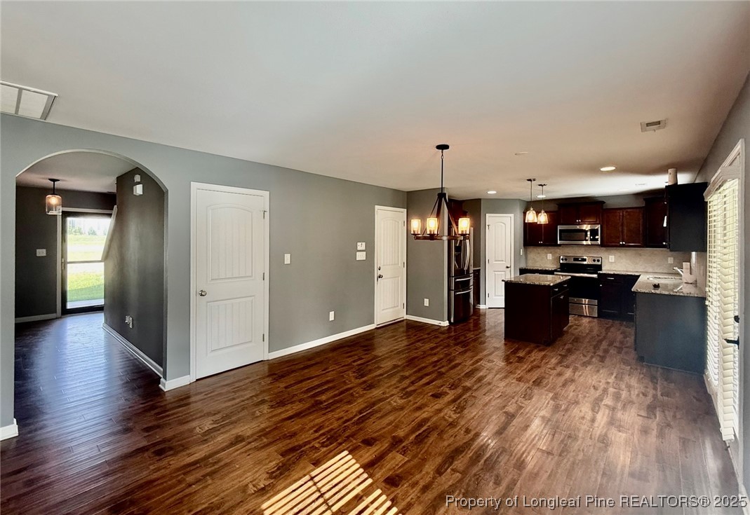 512 Townsend Road Raeford, NC 28376 - Photo 10 of 20 a view of kitchen with cabinets appliances and wooden floor