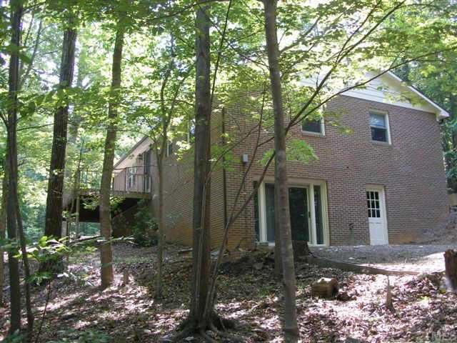 1028 Bahama Road Bahama, NC 27503 - Photo 2 of 10 A good view of the basement outside entry area. There is also an inside entry.