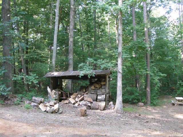 1028 Bahama Road Bahama, NC 27503 - Photo 3 of 10 A real wood shed. The home has gas heat and a woodstove/furnace that connects into the duct system and provides heated air throughout the home. You will like the dry wood.