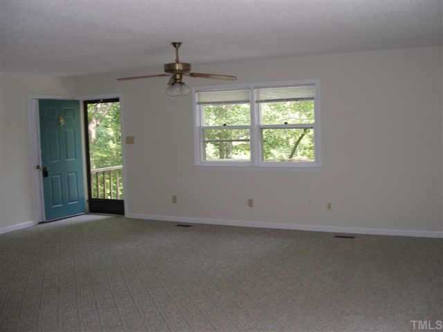 1028 Bahama Road Bahama, NC 27503 - Photo 6 of 10 The Living Room is big and flows into the Dining Room and has a pass through to the Kitchen. It has built in book shelves and is great for entertaining.