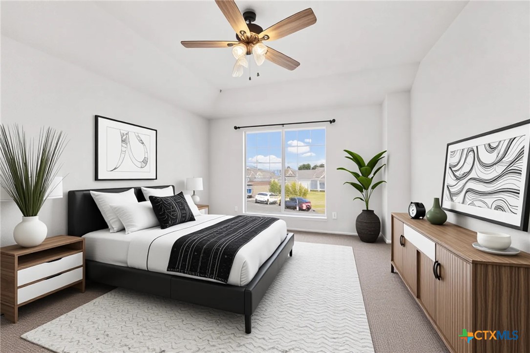 2117 Schwald Road Killeen, TX 76543 - Photo 14 of 29 a bedroom with a large bed and a chandelier