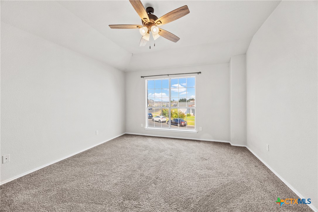 2117 Schwald Road Killeen, TX 76543 - Photo 15 of 29 an empty room with windows and ceiling fan