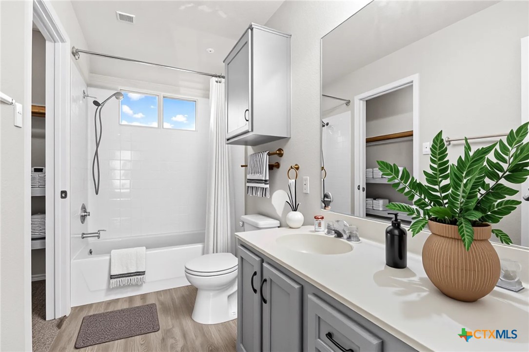 2117 Schwald Road Killeen, TX 76543 - Photo 17 of 29 a bathroom with a sink a toilet and shower