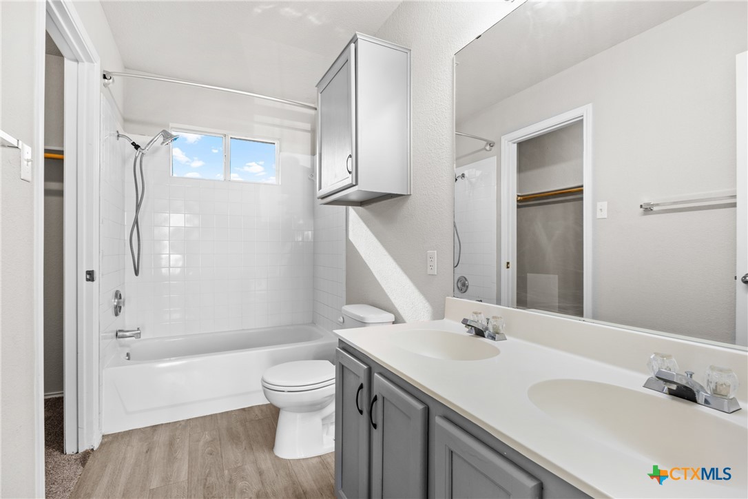 2117 Schwald Road Killeen, TX 76543 - Photo 18 of 29 a bathroom with a sink a toilet and shower