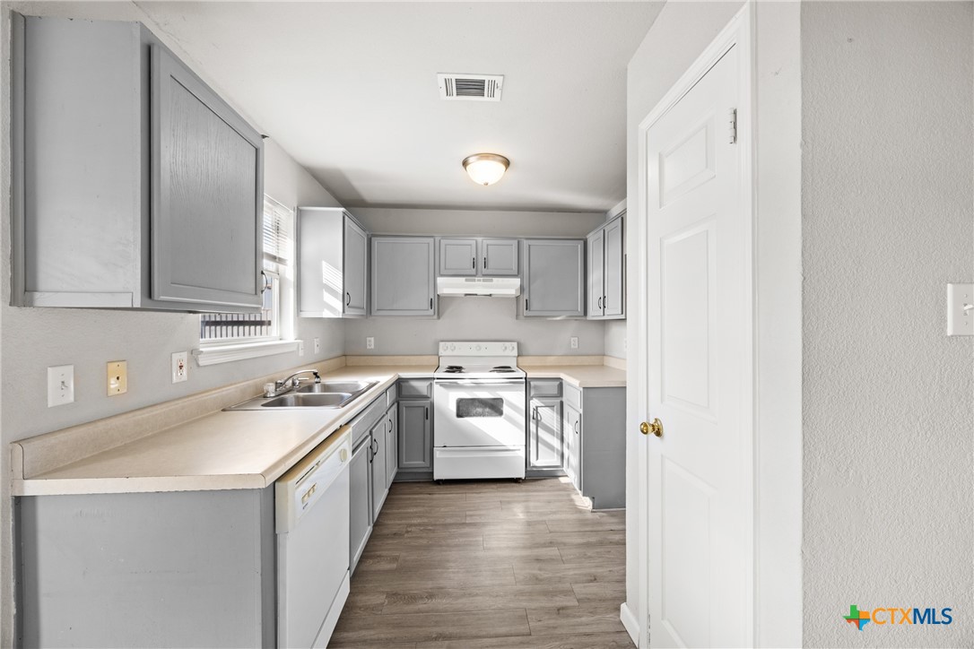 2117 Schwald Road Killeen, TX 76543 - Photo 10 of 29 a kitchen with a sink stove top oven and cabinets