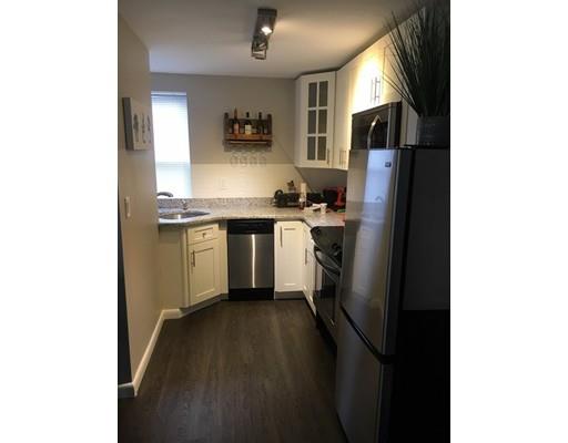 5 Coburn Avenue Worcester, MA 01604 - Photo 11 of 20 a kitchen with cabinets and a refrigerator
