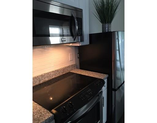 5 Coburn Avenue Worcester, MA 01604 - Photo 12 of 20 a kitchen with a sink and a stove