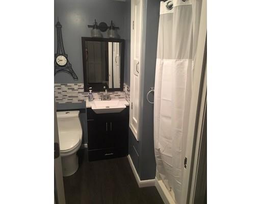 5 Coburn Avenue Worcester, MA 01604 - Photo 18 of 20 a bathroom with a sink a toilet and a mirror