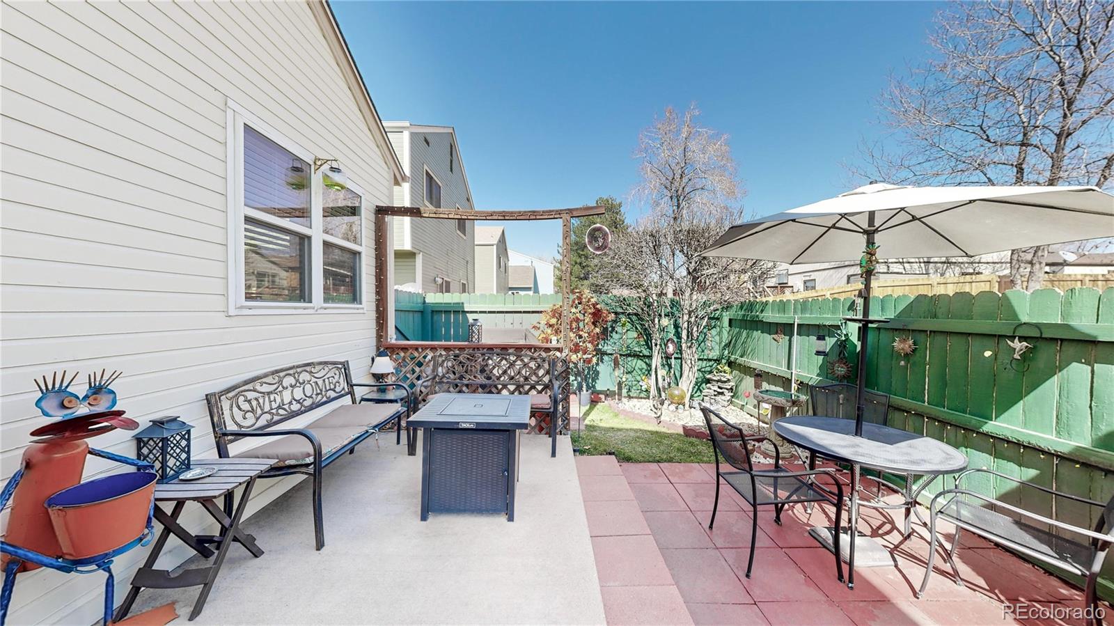 8906 Everett Street Broomfield, CO 80021 - Photo 21 of 35 a patio with a patio table and chairs