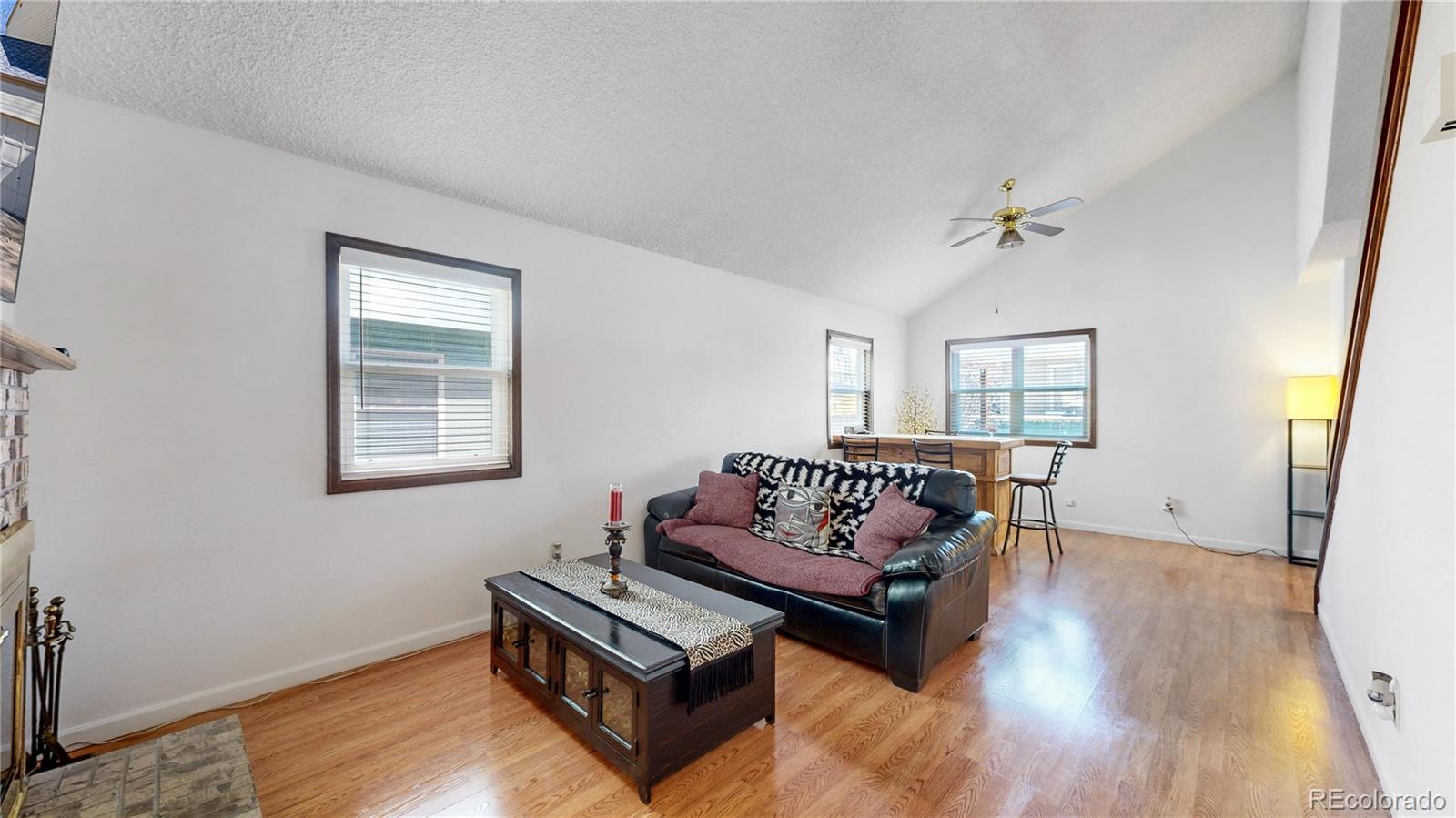 8906 Everett Street Broomfield, CO 80021 - Photo 3 of 35 a living room with furniture and a window