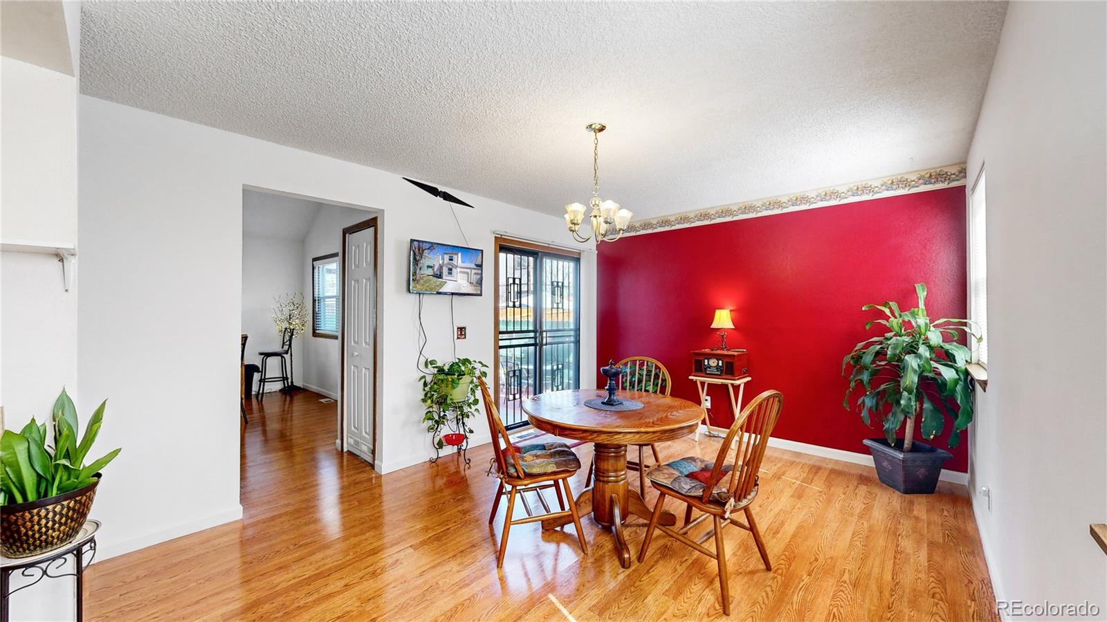 8906 Everett Street Broomfield, CO 80021 - Photo 10 of 35 a dining room with furniture and potted plants