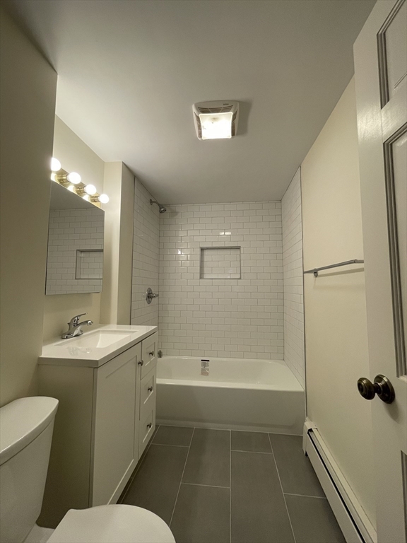 26-28 Adrian Street Somerville, MA 02143 - Photo 11 of 32 a bathroom with a sink a toilet and shower
