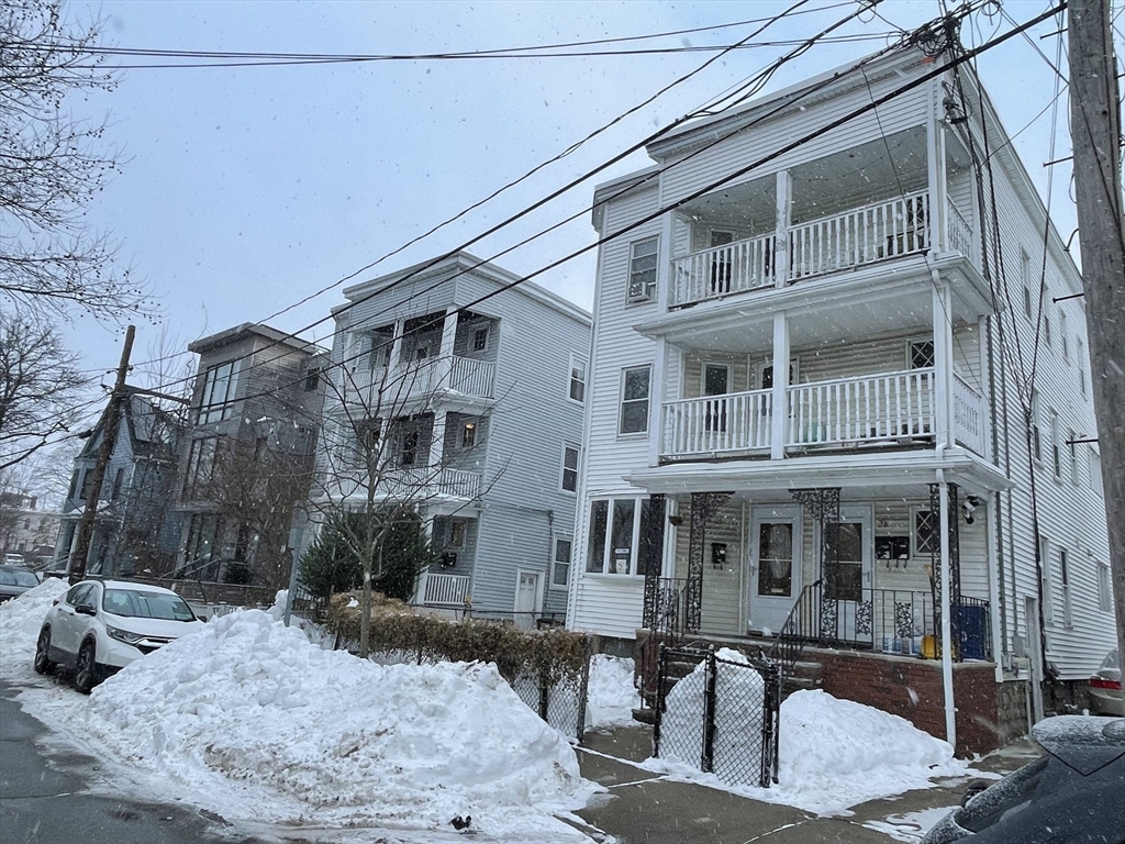 26-28 Adrian Street Somerville, MA 02143 - Photo 2 of 32 a front view of a building with street