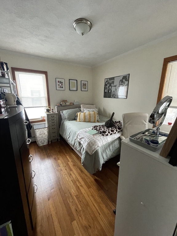 26-28 Adrian Street Somerville, MA 02143 - Photo 24 of 32 a bedroom with a bed and a couch