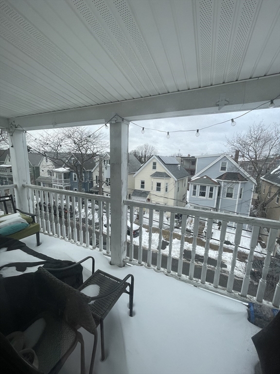 26-28 Adrian Street Somerville, MA 02143 - Photo 3 of 32 a view of a balcony with chairs