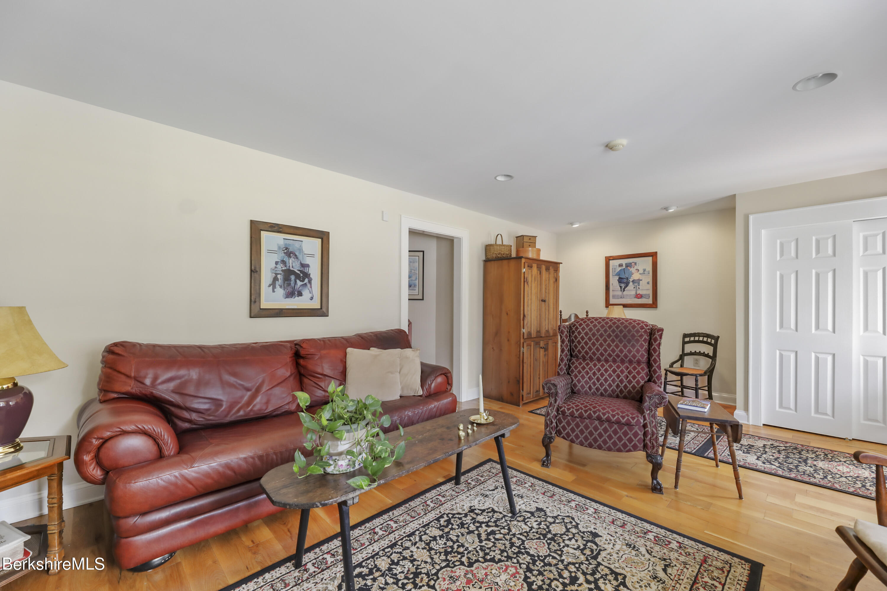 125 Center Street, Unit 2 Lee, MA 01238 - Photo 11 of 39 a living room with furniture and a window