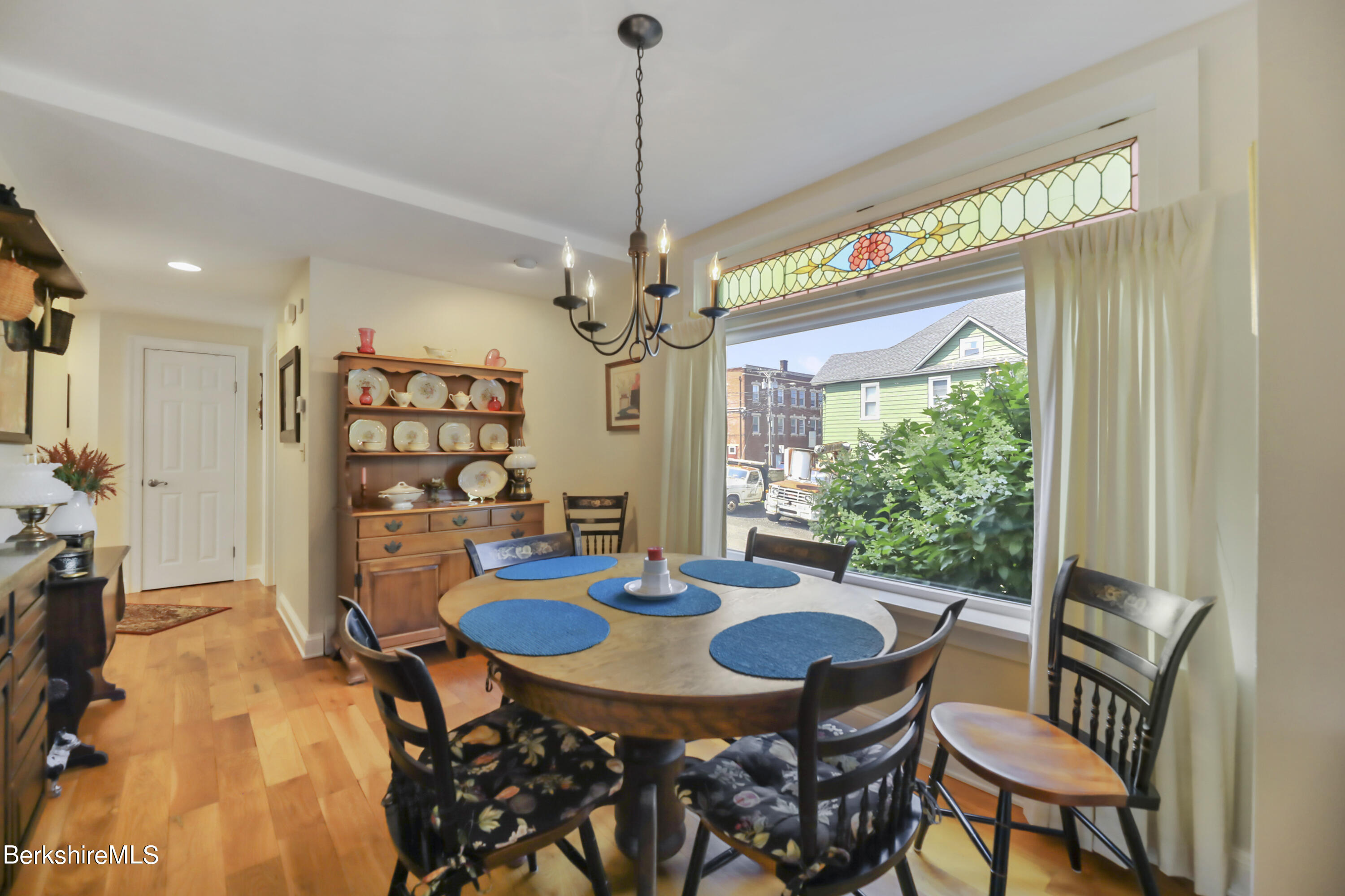 125 Center Street, Unit 2 Lee, MA 01238 - Photo 16 of 39 a view of a dining room with furniture window and wooden floor