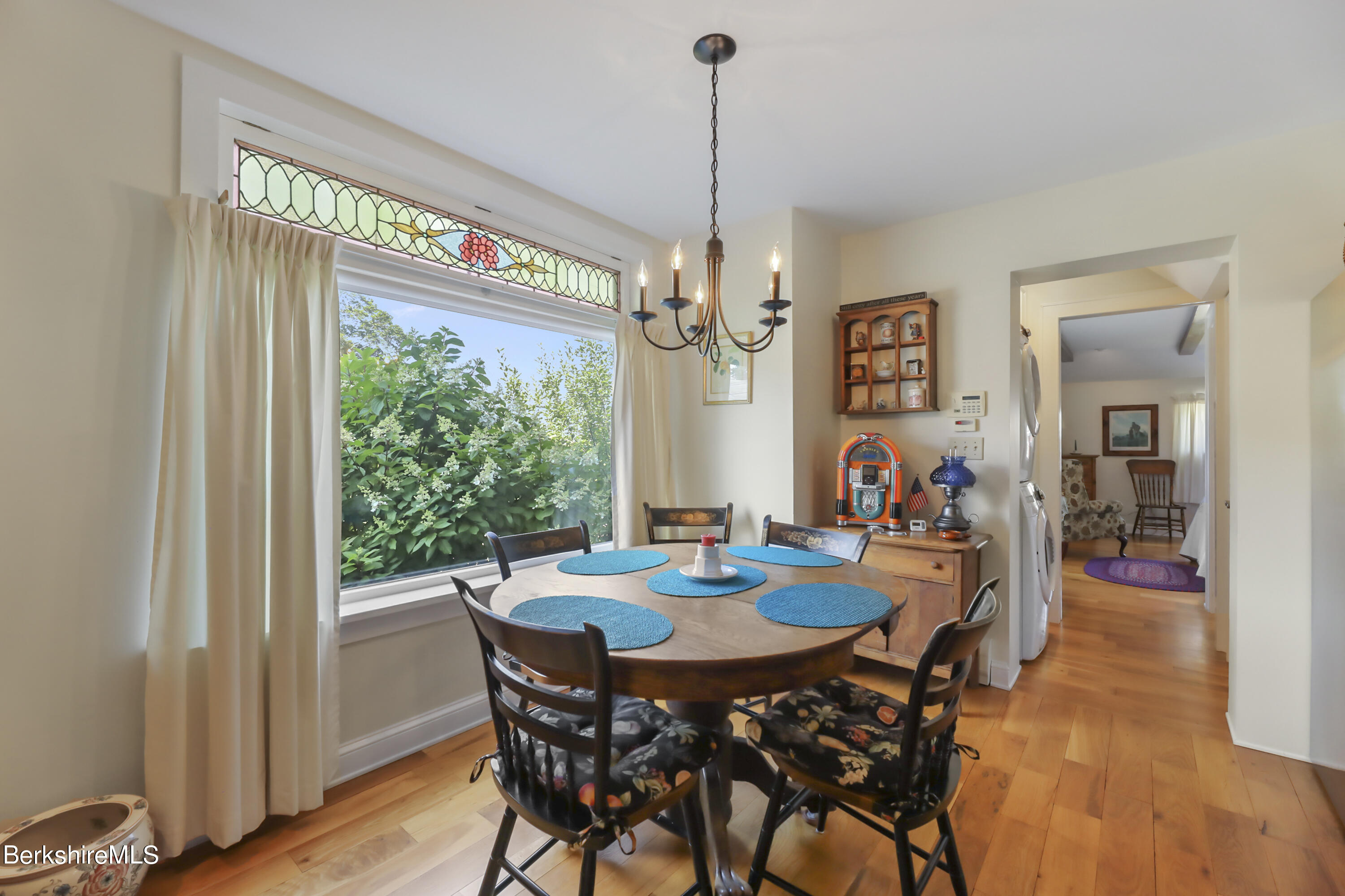 125 Center Street, Unit 2 Lee, MA 01238 - Photo 17 of 39 a view of a dining room with furniture window and wooden floor