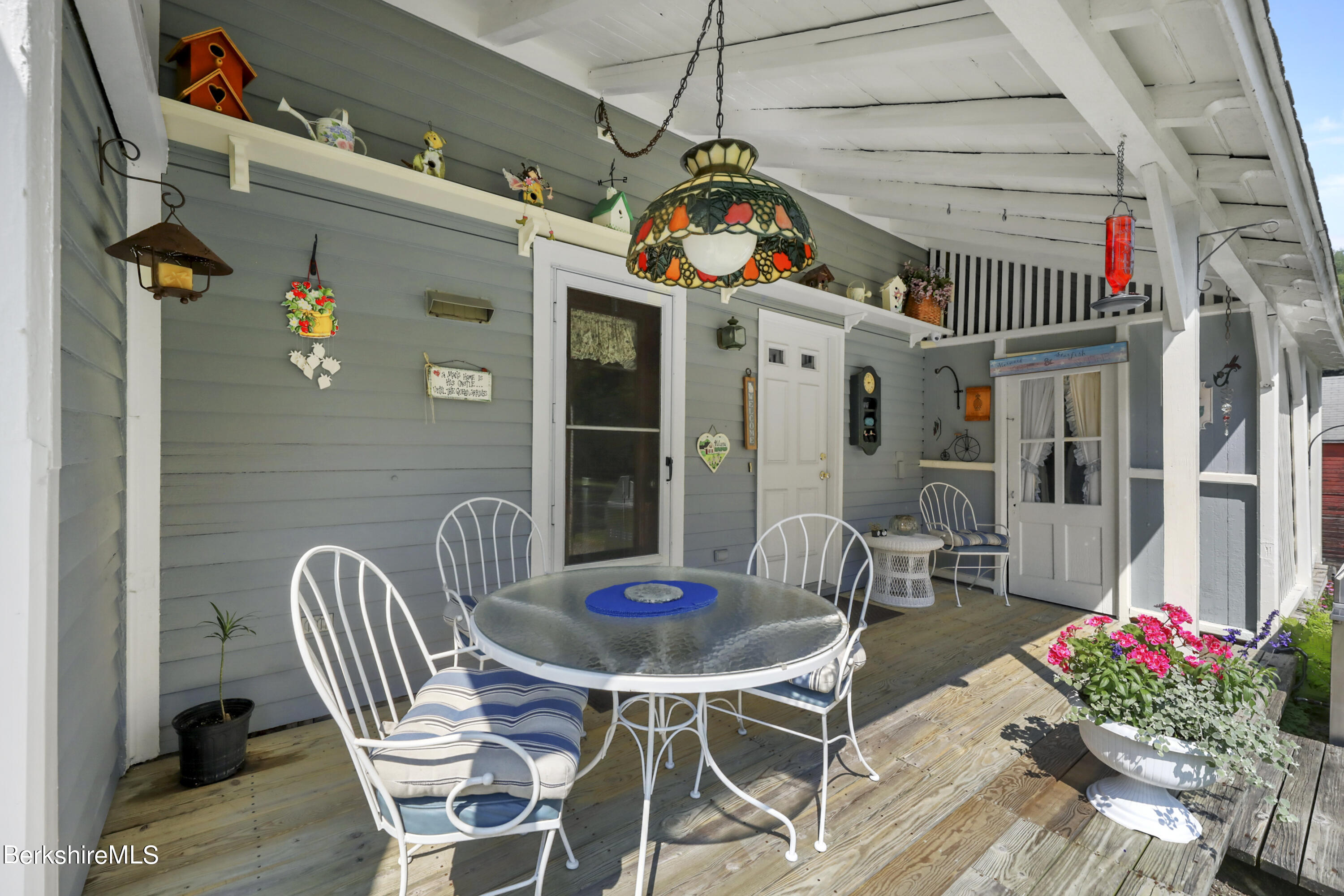 125 Center Street, Unit 2 Lee, MA 01238 - Photo 19 of 39 a view of a dining room with furniture window and outdoor kitchen