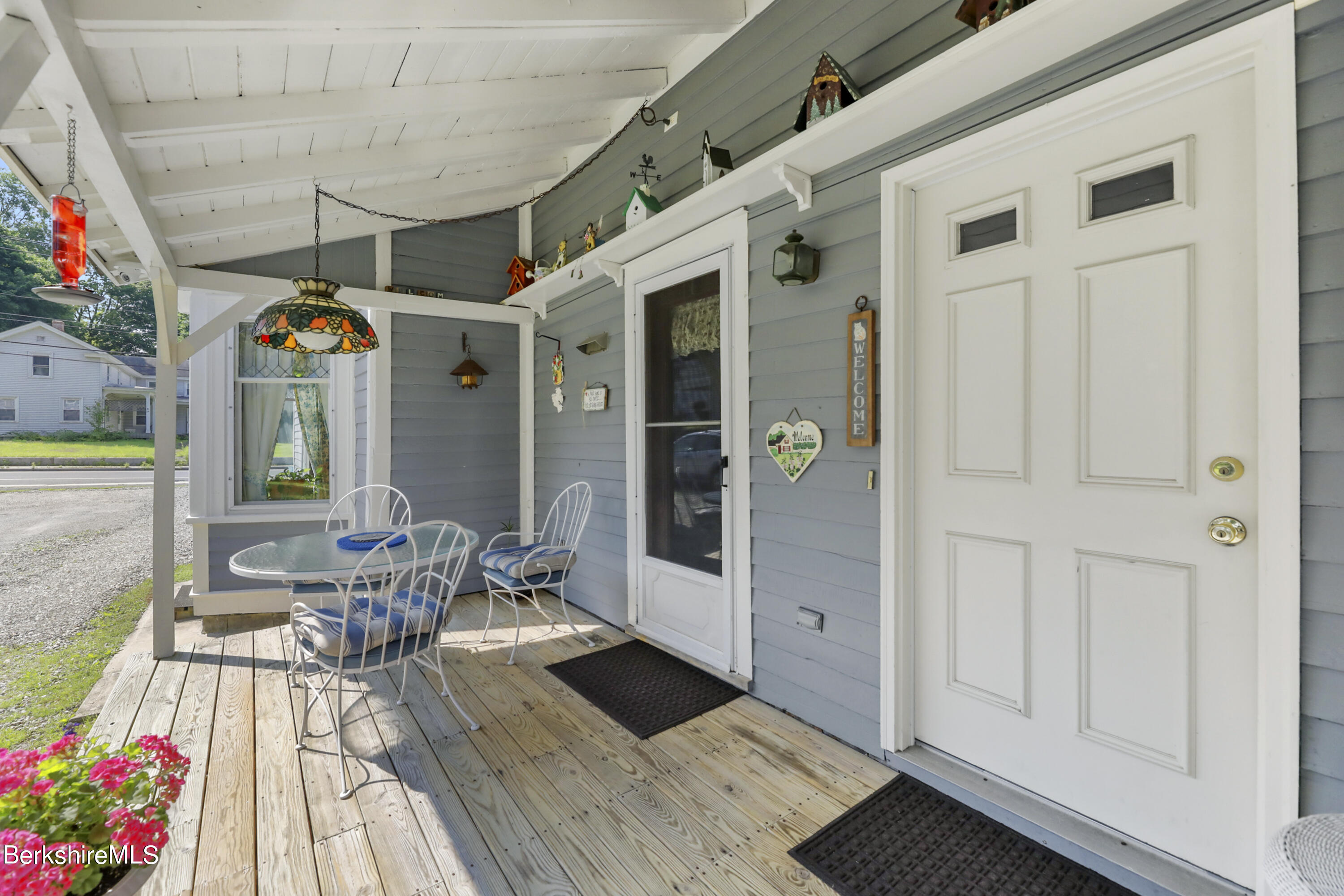 125 Center Street, Unit 2 Lee, MA 01238 - Photo 20 of 39 a view of a patio with dining table and chairs